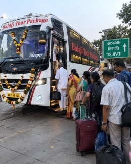 Family of pilgrims boarding the A/C sleeper bus to Tirupati